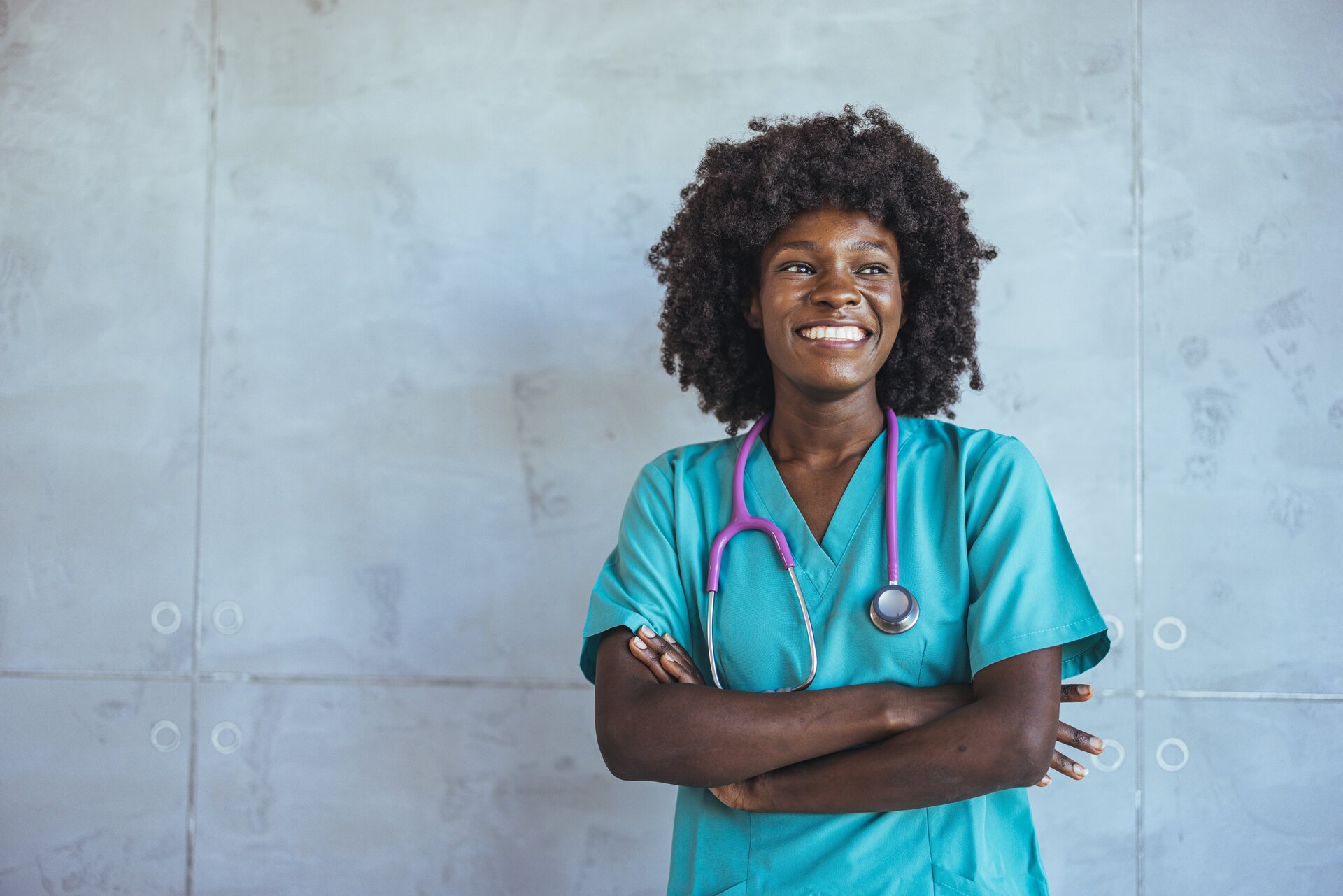 Healthcare professional and durable medical equipment supplier smiling in clinical setting